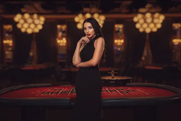 A laptop glowing with a bright login prompt in a minimalistic setup, symbolizing the protected access system at CROWNBD.